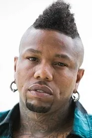 Dominic 'Taz' Alexander en The Funeral Band