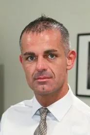 Retrato de John Marcus