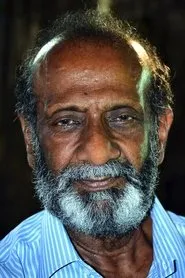 Retrato de T G Ravi