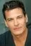 Adam Storke como 