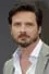 Aden Young como 