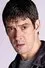 Adrian Bower como Brian