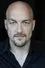 Alexander Gemignani como Janusz