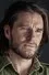 Anthony J. Sharpe como Erik Cowie