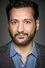Cas Anvar como Sanjay Desai
