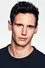 Cory Michael Smith como Kevin Coulson