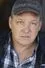 Dane Rhodes como Detective Favre