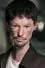 Darren Kent como The Scholar