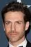 David Julian Hirsh como Richard Conrad / Blue Bolt