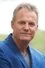 David Reyne como Dr. Guy Reid
