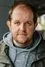 Dominic Burgess como Zoltan Grundy