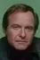 Ed Gilbert como 