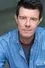 Gavin Lee como Alan Woodford