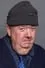 Ian McNeice como Newsreader