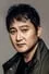 Jeong Man-sik como Min Jae-shik