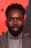 Jimmy Akingbola como Carter (uncredited)