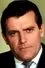 John Collin como Det. Sergeant Charles Atrass