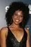 Karla Mosley como Elodie Baxter