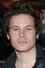 Kris Lemche como Greg Hillinger