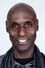 Lance Reddick como Desmond Mobay