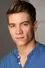 Lucas Adams como Tripp Johnson