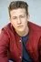Luke Mullen como TJ