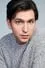 Nicholas Braun como Greg Hirsch