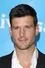 Parker Young como Alex Davis