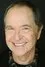 Paul Collins como SecNav Alexander Nelson