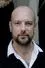Stephan Zinner como Dennis Eden