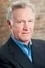 Tom Butler como Greg Trotter