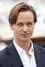 Tom Schilling como Tom Novak